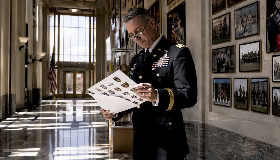 Army officer reading branch insignia regulations