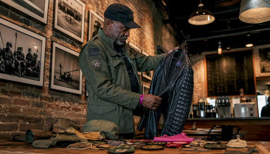 Veteran browsing heritage brand apparel in boutique