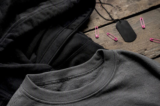 Partial crewneck and hoodie fabric details flat lay
