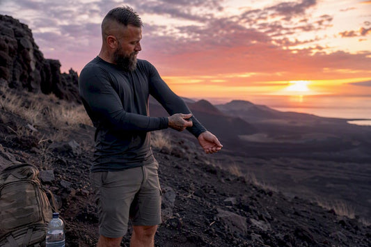 Veteran examining moisture-wicking shirt fabric detail
