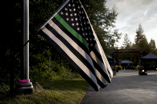 Thin green line flag outside community event